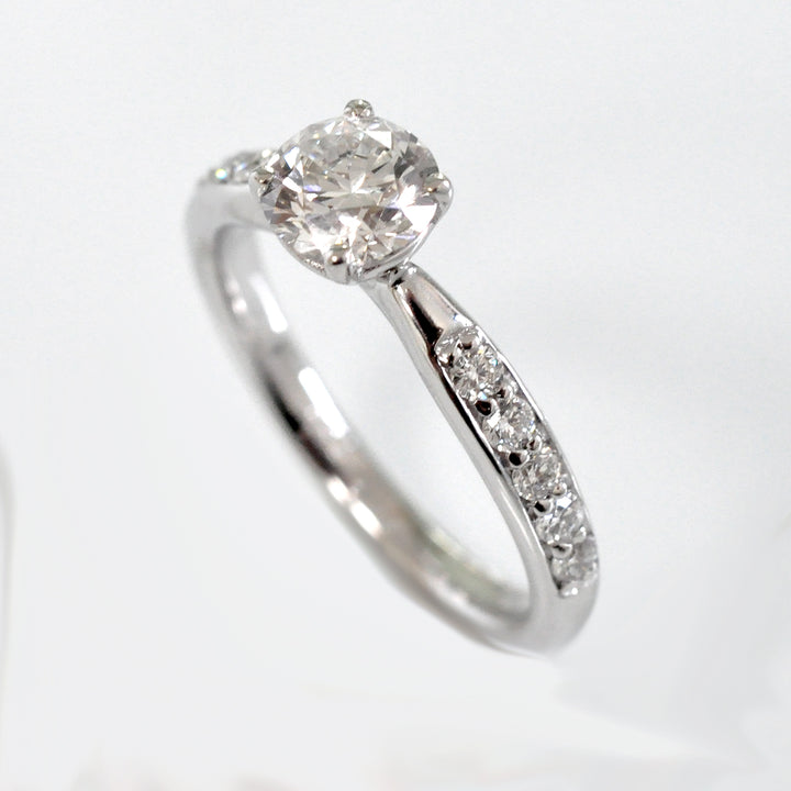 Center &amp; side diamonds engagement ring