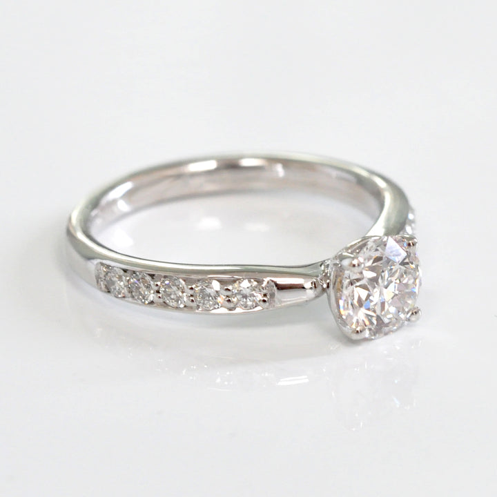 Center &amp; side diamonds engagement ring