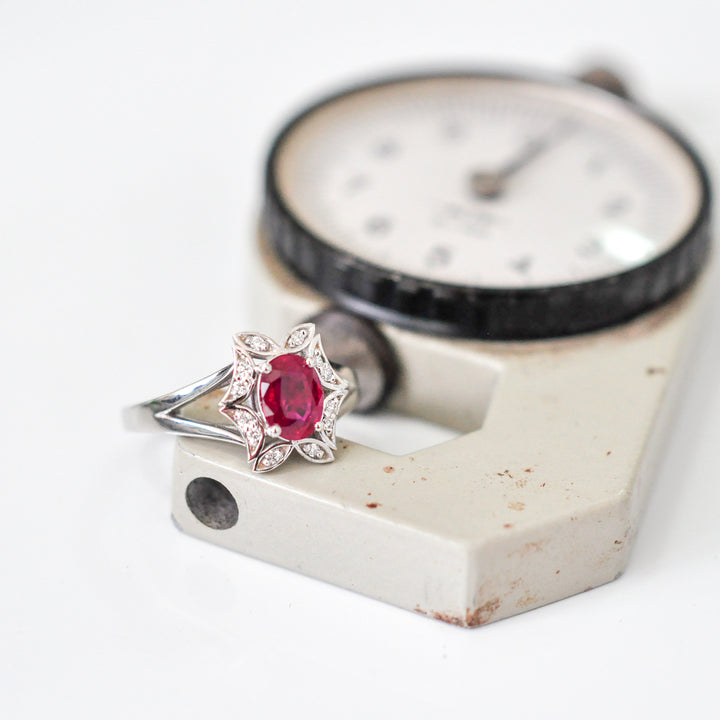 OVAL RUBY and diamonds FLOWER SHAPE HALO RING