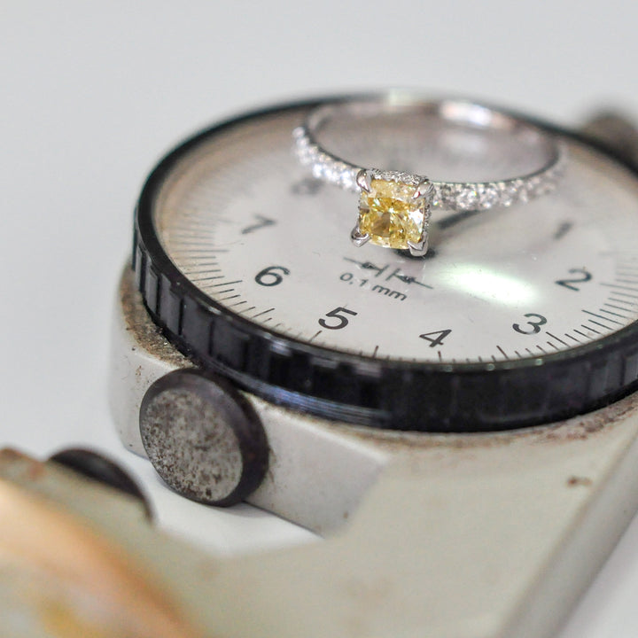 yellow cushion diamond &amp; white diamonds ring