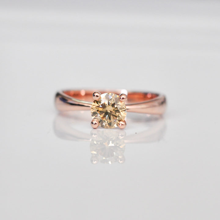 0.5 ct brown diamond Wide to thin shank 4 prongs solitaire.