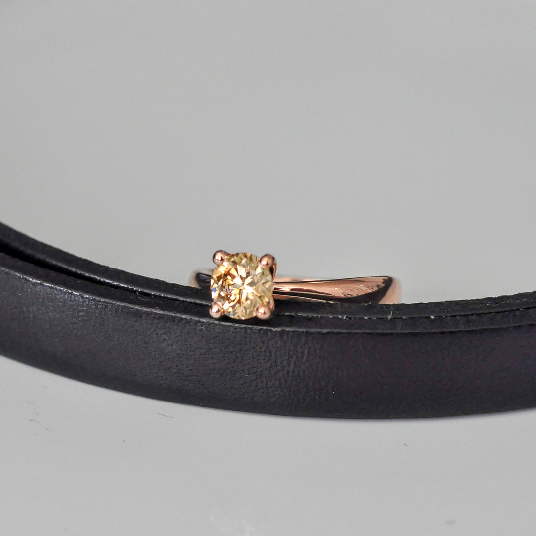 0.5 ct brown diamond Wide to thin shank 4 prongs solitaire.