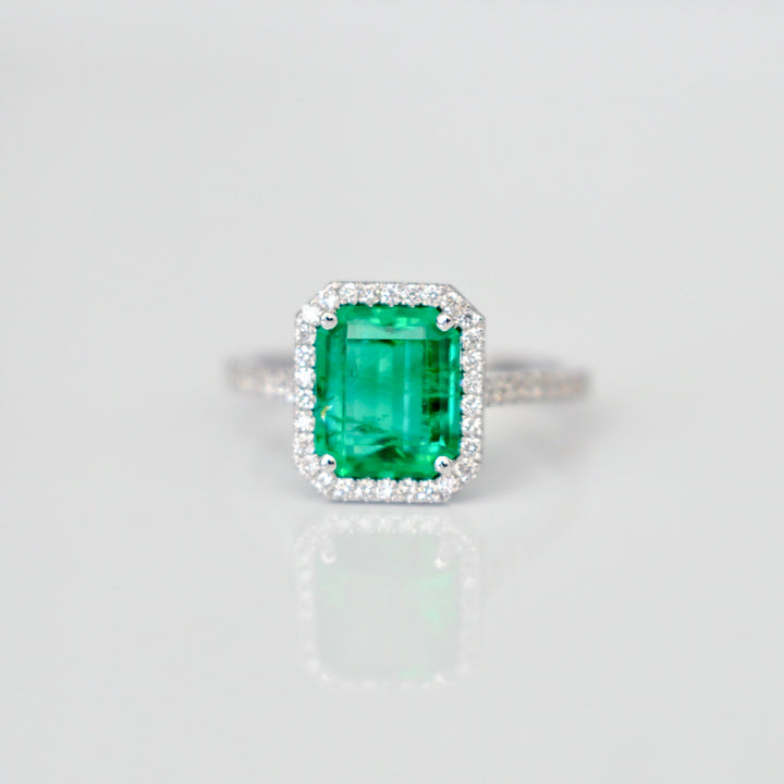 Green Emerald (1.5 carat) and diamonds halo ring