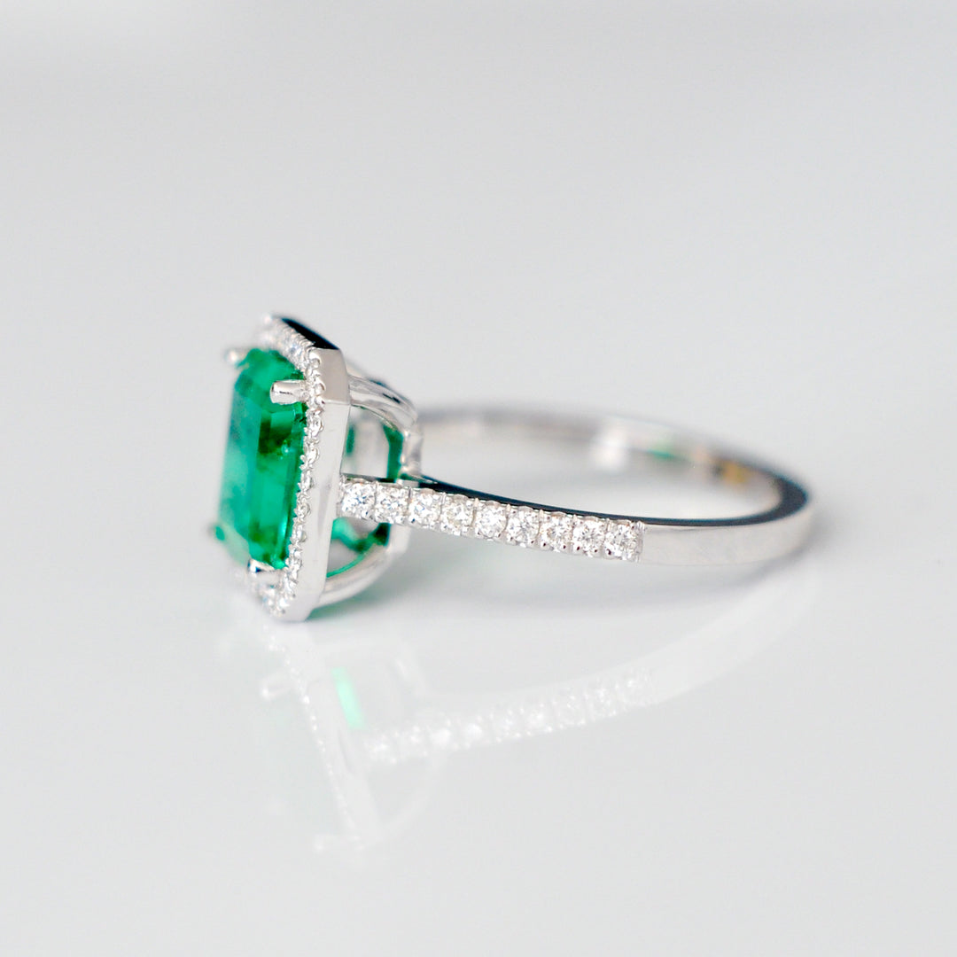 Green Emerald (1.5 carat) and diamonds halo ring