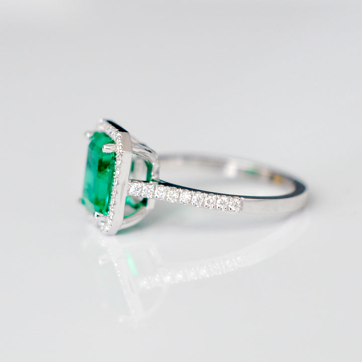 Green Emerald (1.5 carat) and diamonds halo ring
