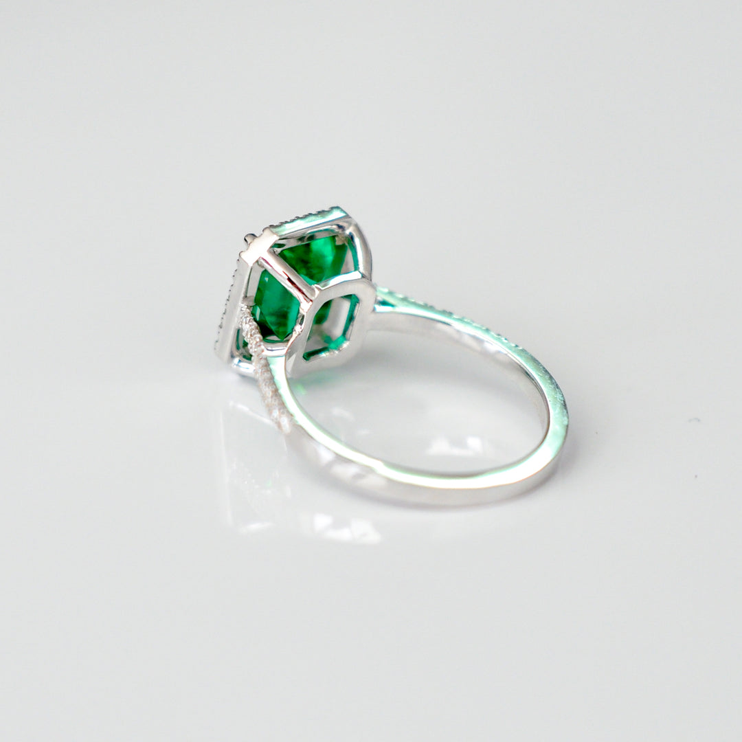 Green Emerald (1.5 carat) and diamonds halo ring