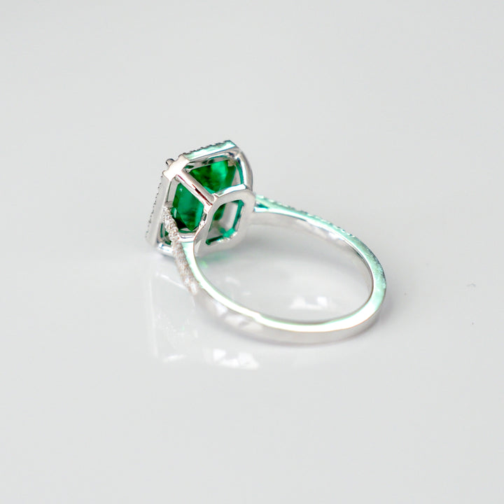 Green Emerald (1.5 carat) and diamonds halo ring