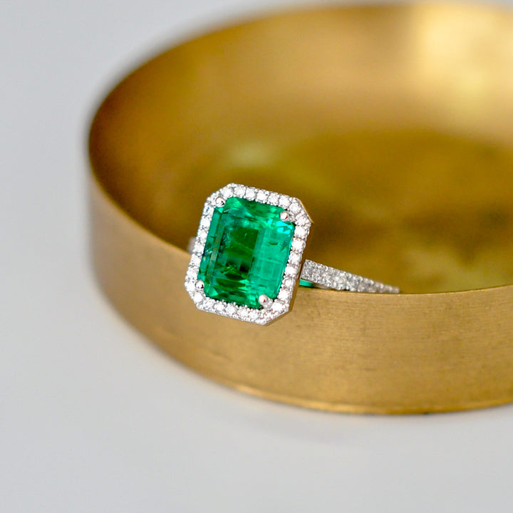 Green Emerald (1.5 carat) and diamonds halo ring