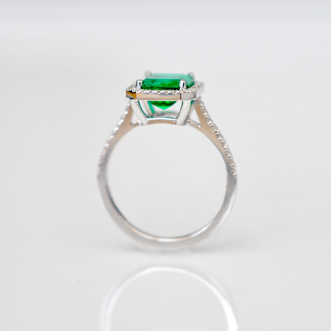 Green Emerald (1.5 carat) and diamonds halo ring