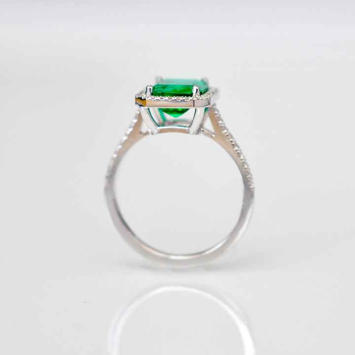 Green Emerald (1.5 carat) and diamonds halo ring