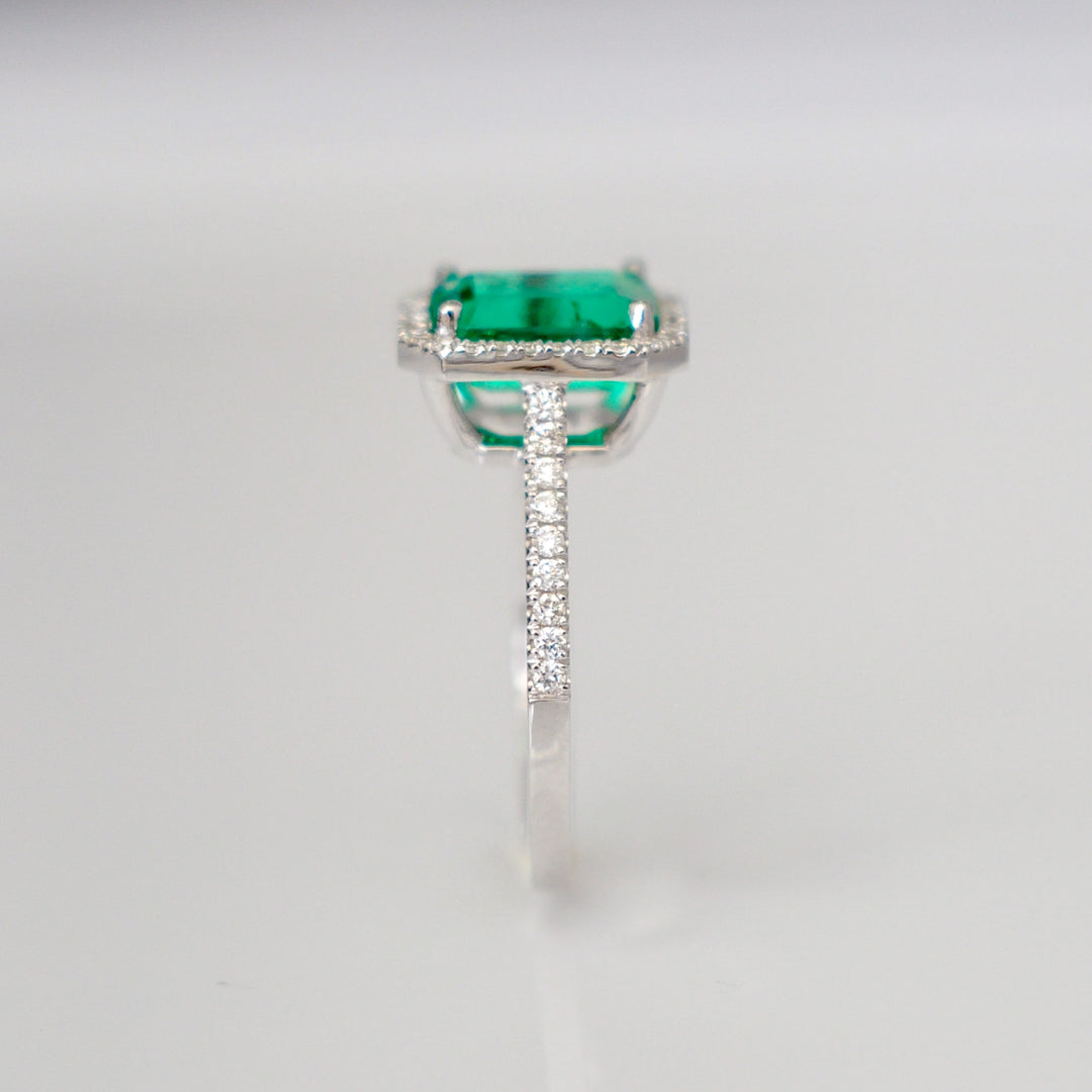 Green Emerald (1.5 carat) and diamonds halo ring