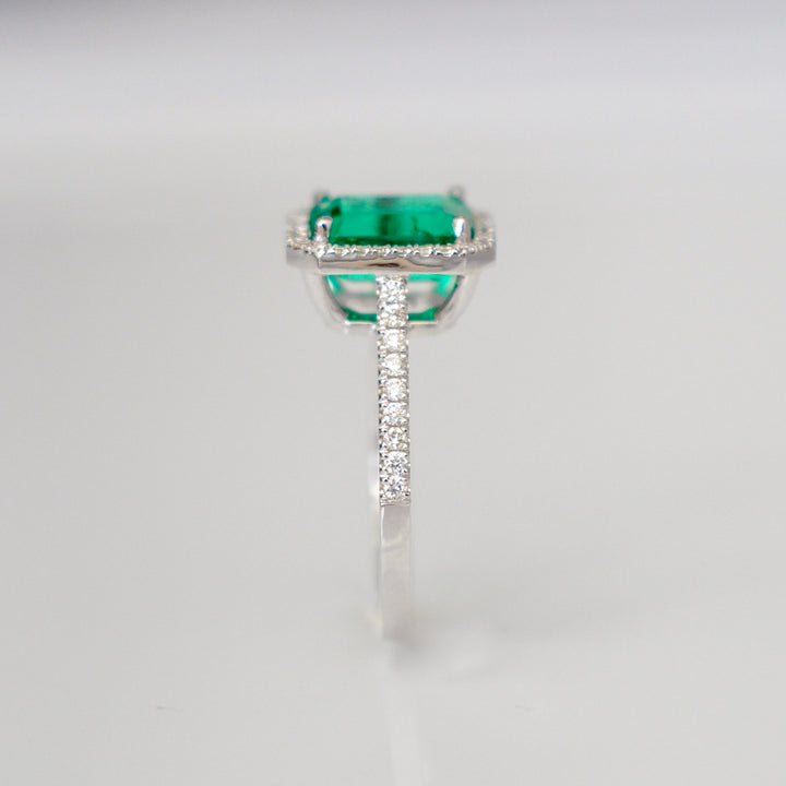 Green Emerald (1.5 carat) and diamonds halo ring