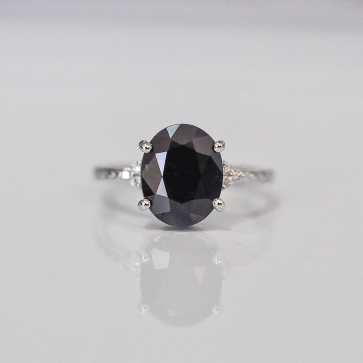 Oval Black Sapphire and side diamonds ring