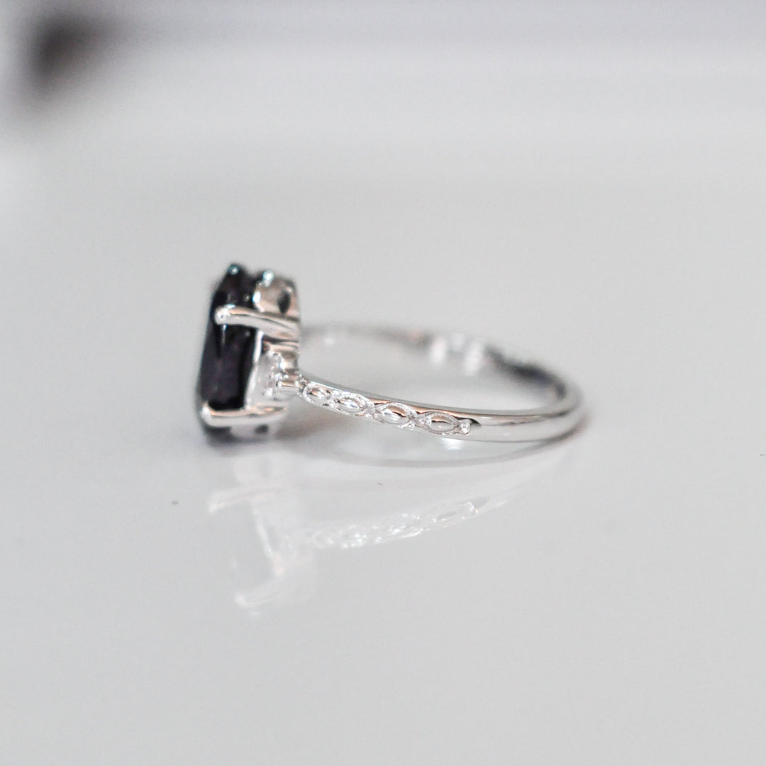 Oval Black Sapphire and side diamonds ring