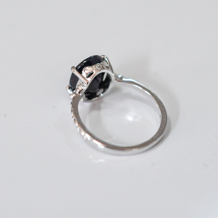 Oval Black Sapphire and side diamonds ring