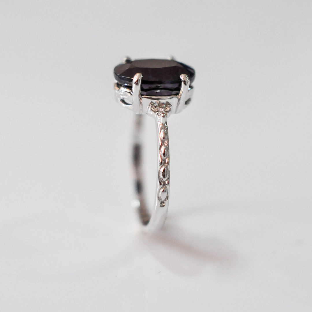 Oval Black Sapphire and side diamonds ring