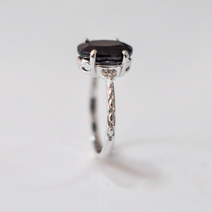 Oval Black Sapphire and side diamonds ring