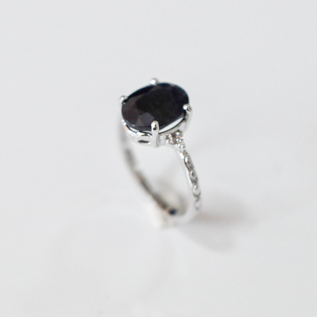 Oval Black Sapphire and side diamonds ring