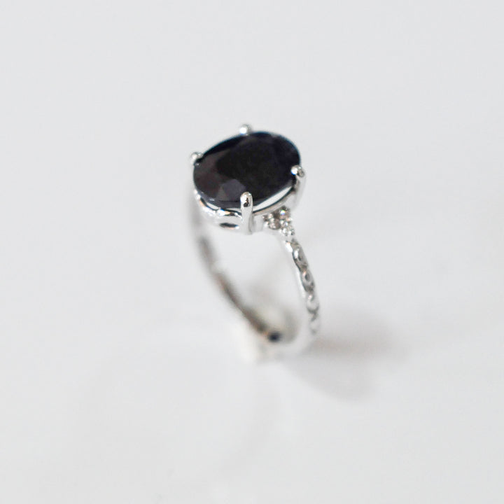 Oval Black Sapphire and side diamonds ring