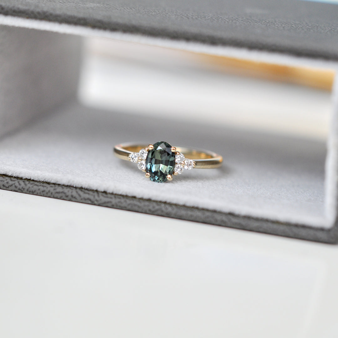green Oval sapphire and 6 diamonds ring