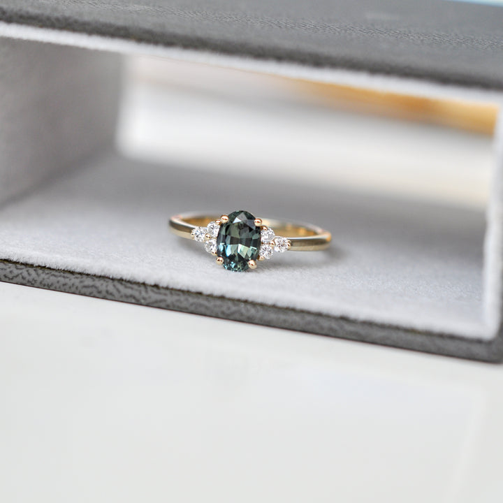 green Oval sapphire and 6 diamonds ring