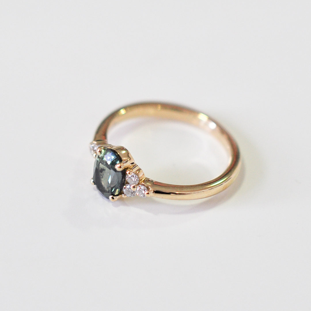 green Oval sapphire and 6 diamonds ring