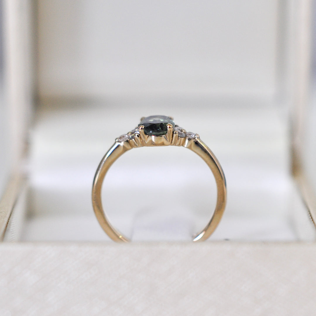 green Oval sapphire and 6 diamonds ring