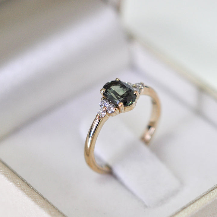 green Oval sapphire and 6 diamonds ring