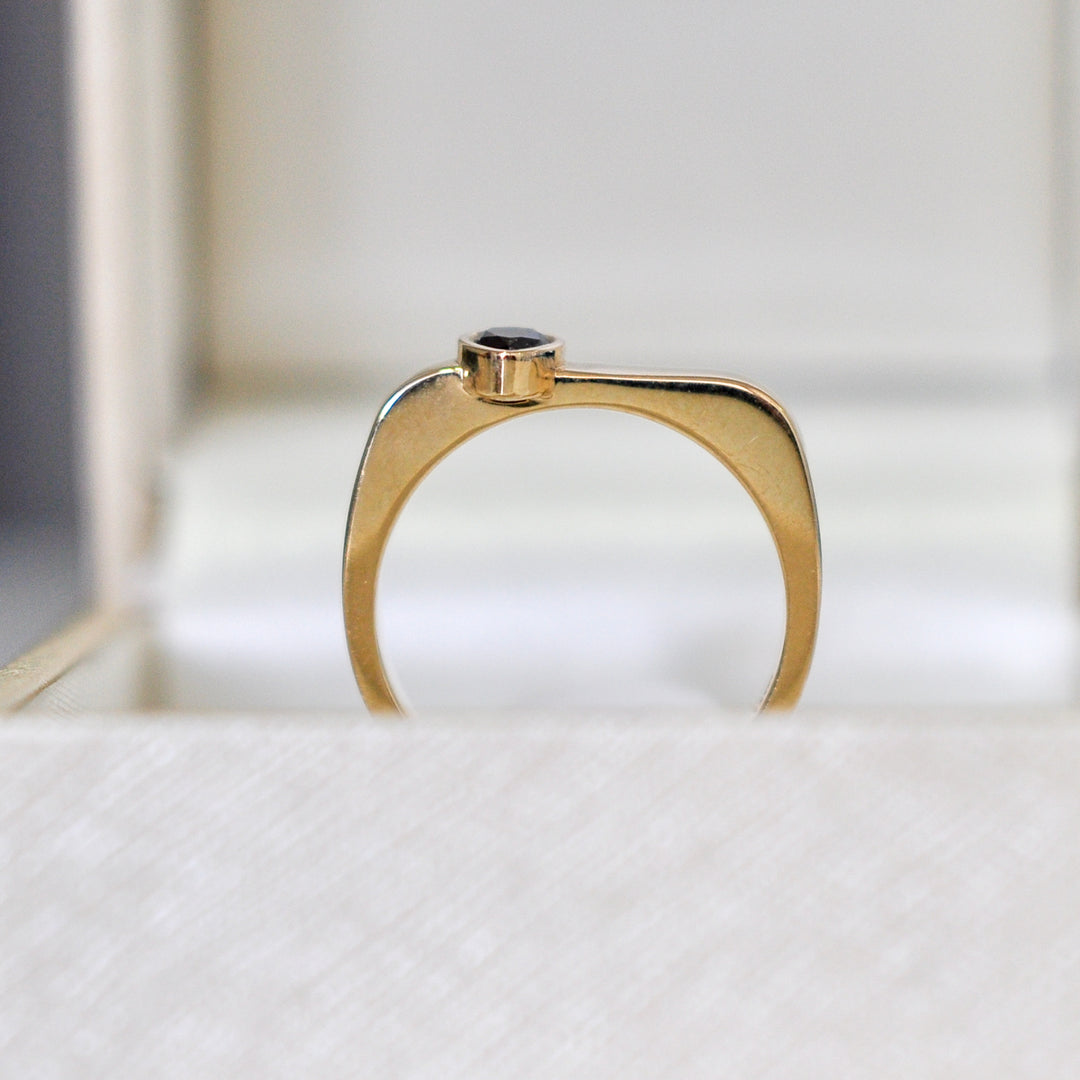 pear shape black diamond yellow gold ring