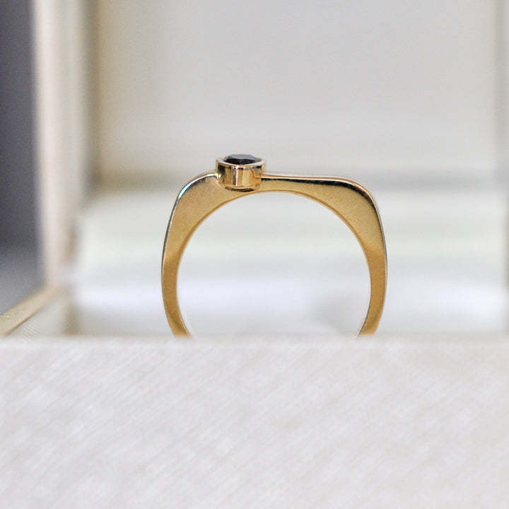 pear shape black diamond yellow gold ring