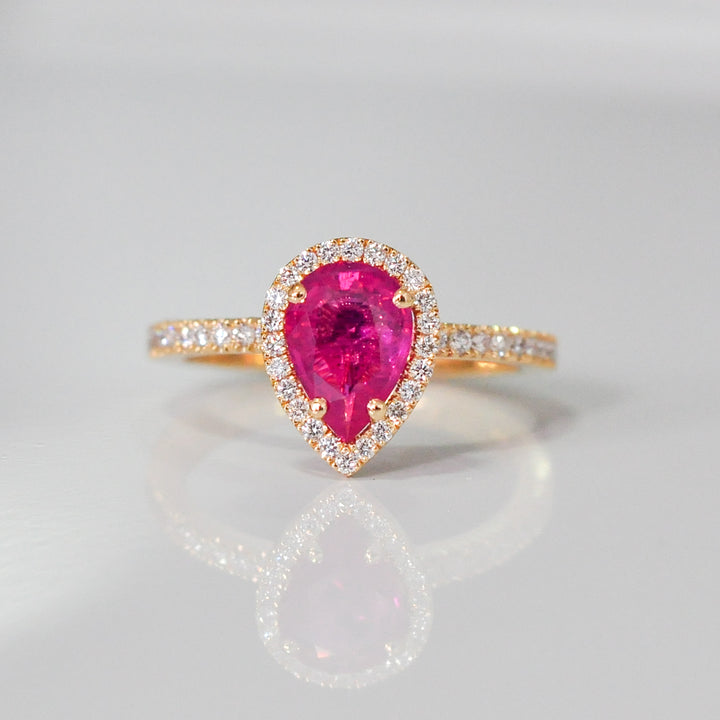 pear shape pinkish ruby halo ring
