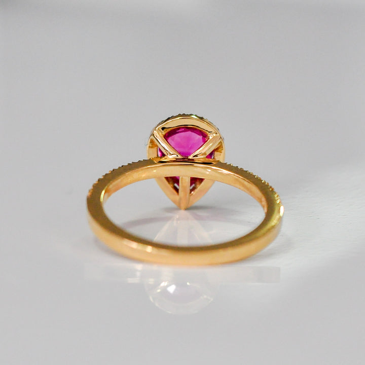 pear shape pinkish ruby halo ring