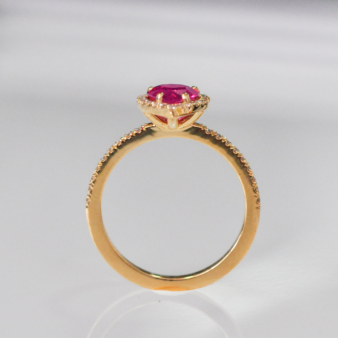 pear shape pinkish ruby halo ring