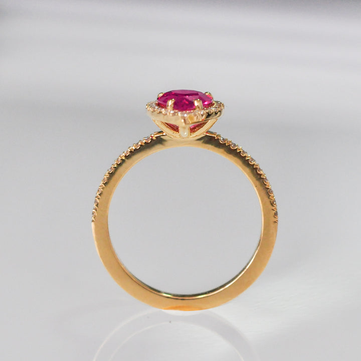 pear shape pinkish ruby halo ring