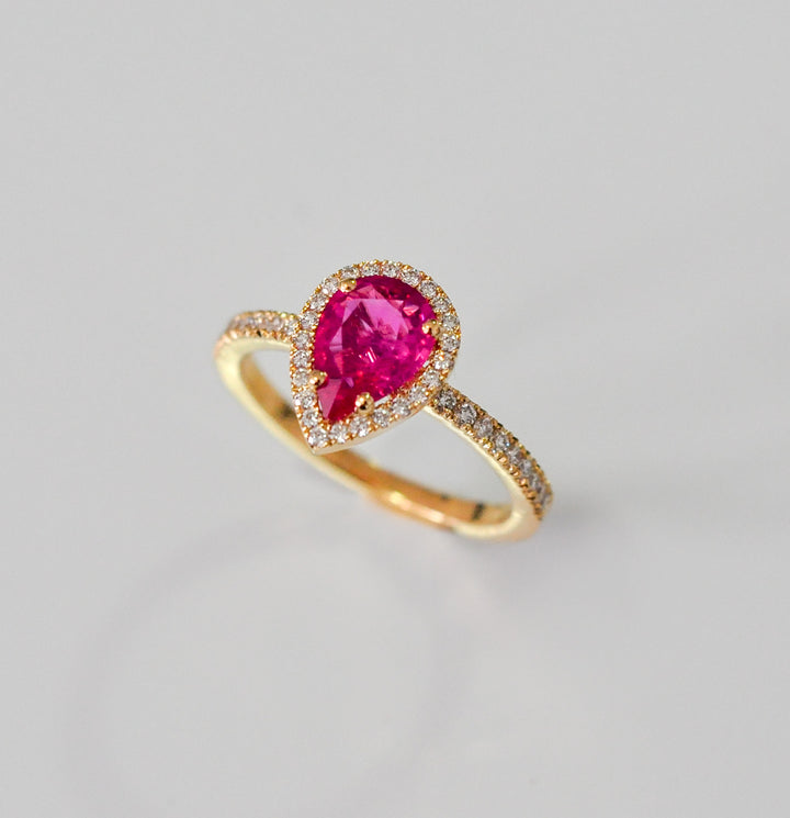 pear shape pinkish ruby halo ring