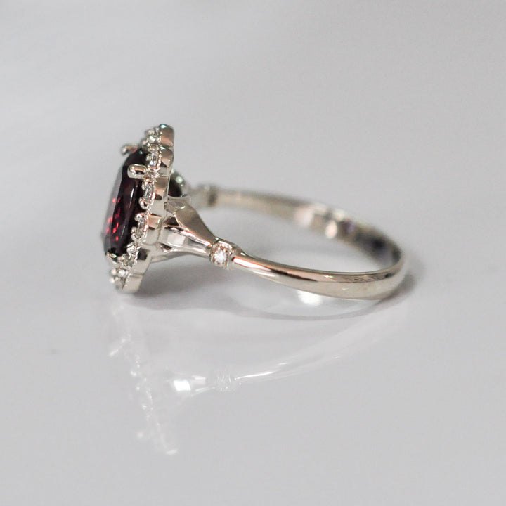 oval cut red garnet and diamonds ring