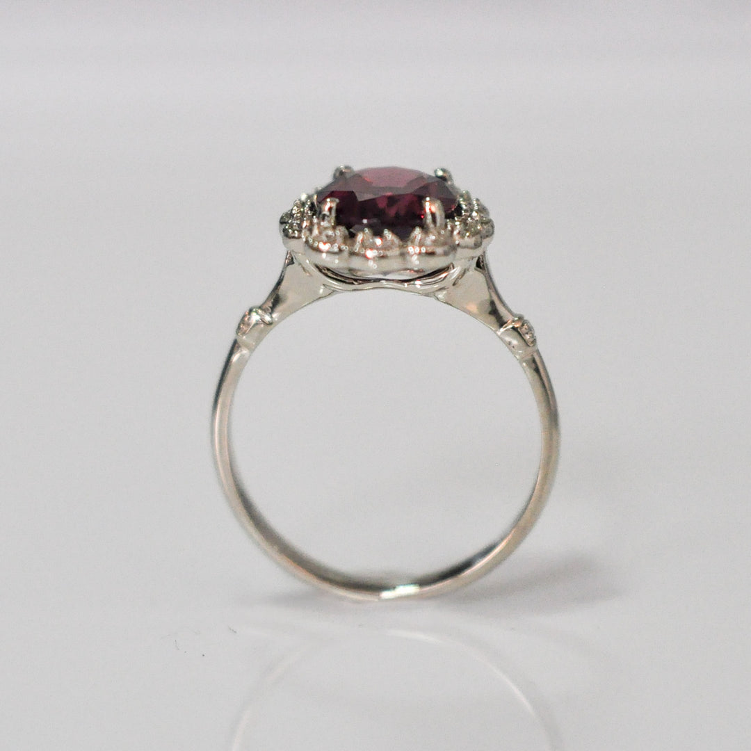 oval cut red garnet and diamonds ring