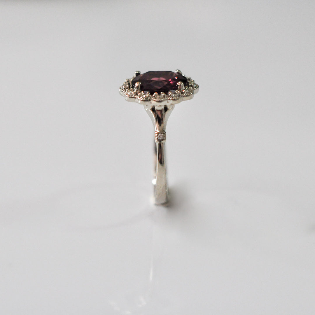 oval cut red garnet and diamonds ring