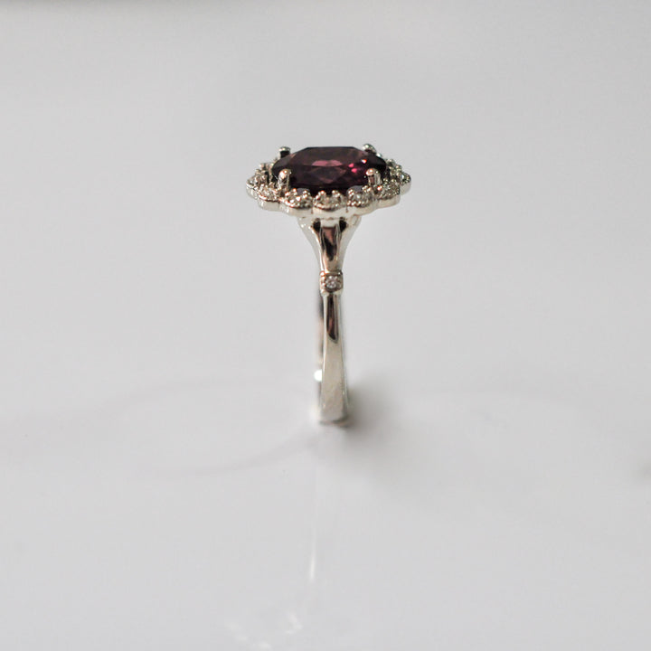 oval cut red garnet and diamonds ring