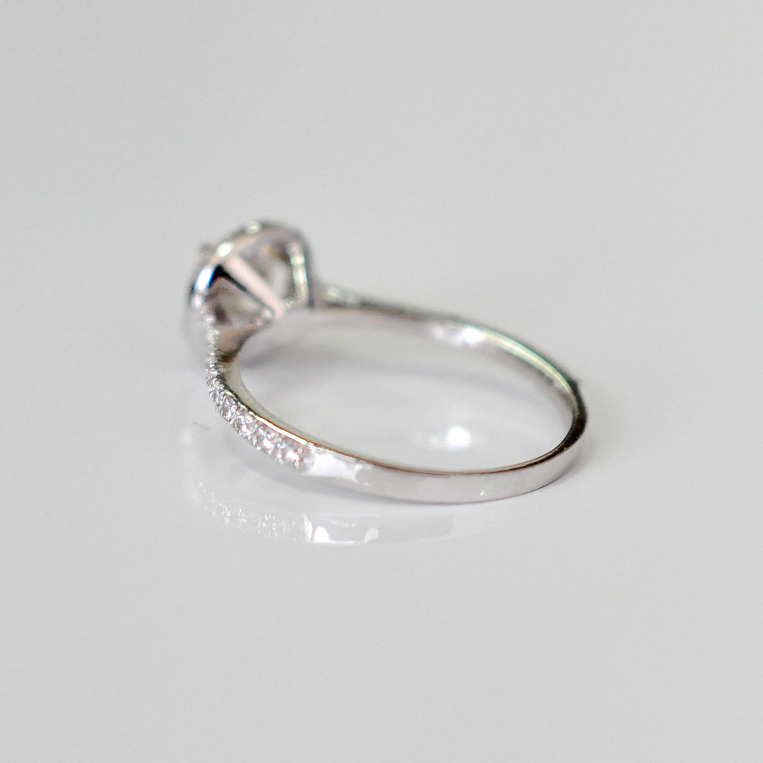 white diamonds (~1 ct. tw.) halo engagement ring