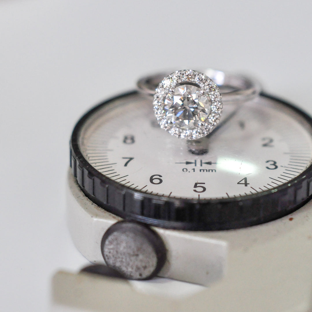 white diamonds (~1.5 ct. tw.) halo engagement ring
