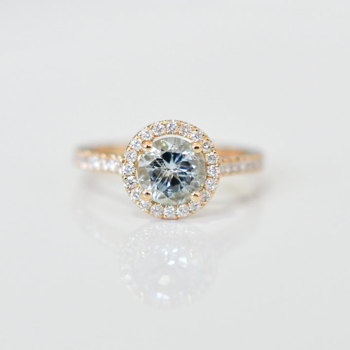 Aquamarine in yellow gold halo ring