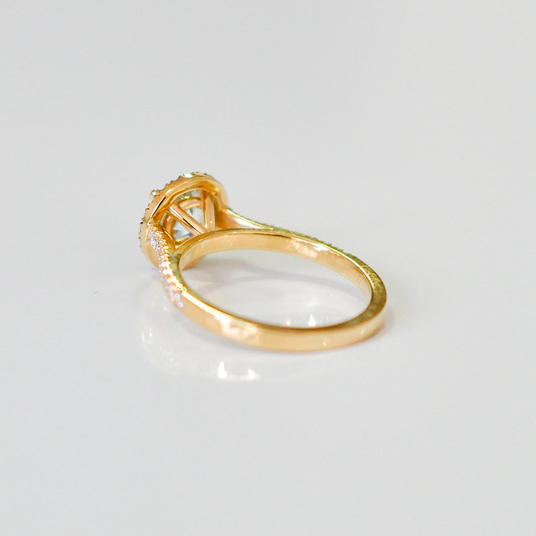 Aquamarine in yellow gold halo ring