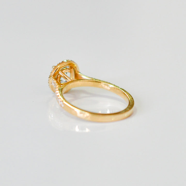 Aquamarine in yellow gold halo ring