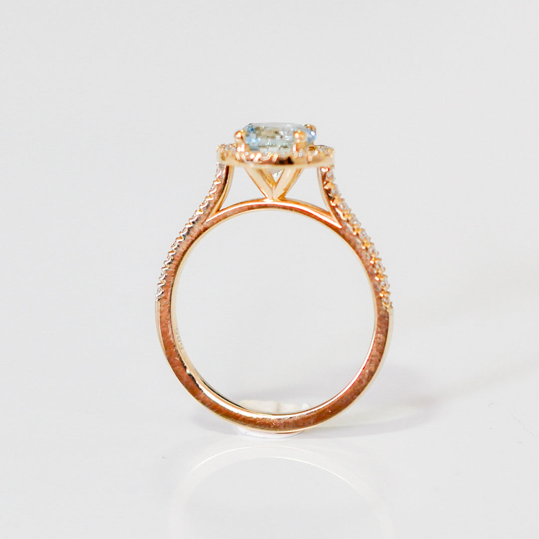 Aquamarine in yellow gold halo ring