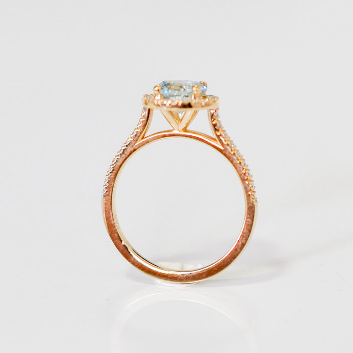 Aquamarine in yellow gold halo ring