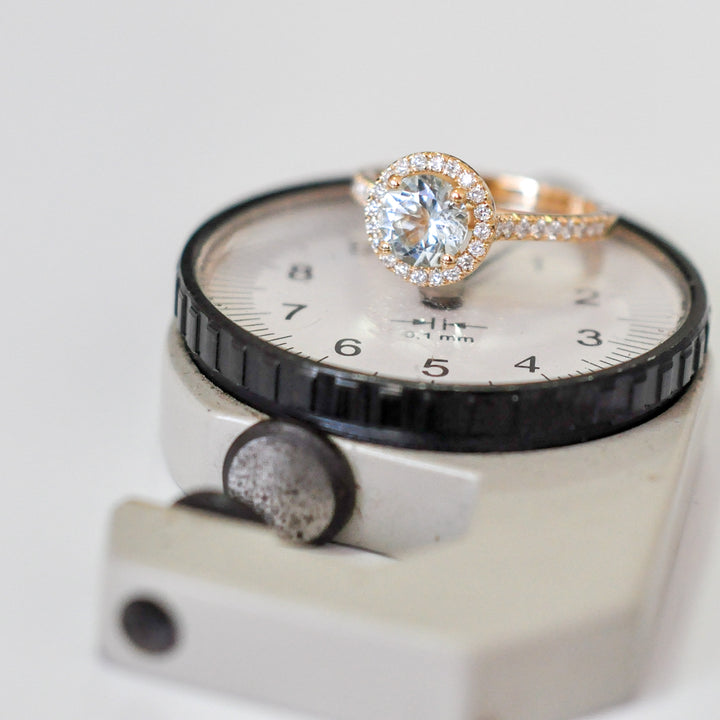 Aquamarine in yellow gold halo ring