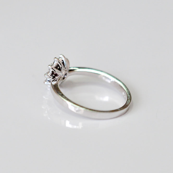 Faint pink center diamond with white diamonds HALO RING