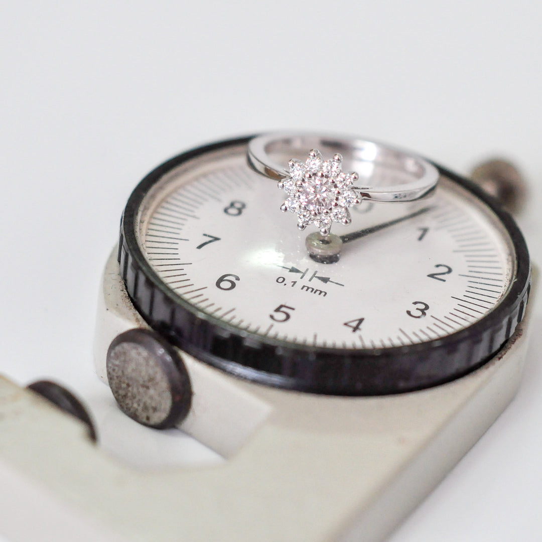 Faint pink center diamond with white diamonds HALO RING