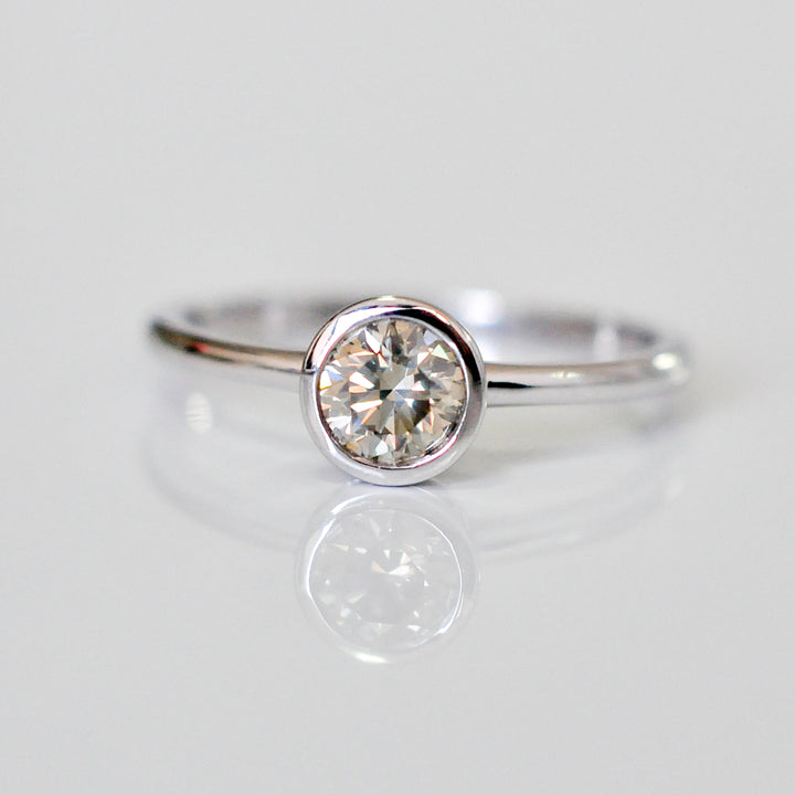 delicate bezel setting 0.5 carat diamond solitaire ring